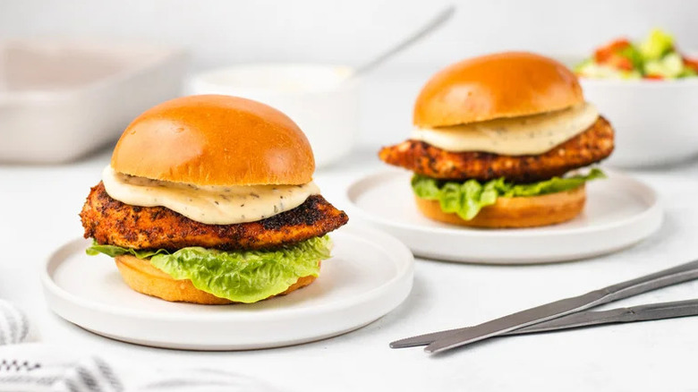Cajun Chicken Alfredo Sandwiches on white plates