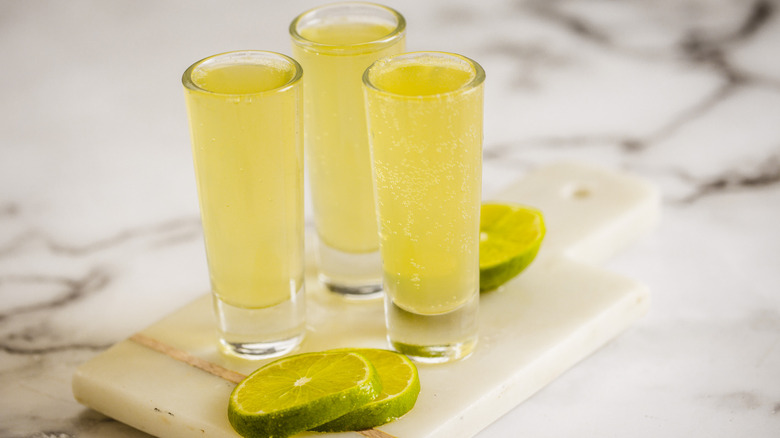 three shot glasses on marble