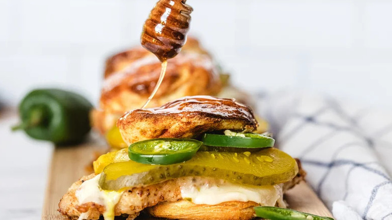 Hot Honey Chicken Biscuit Sandwich on wooden cutting board