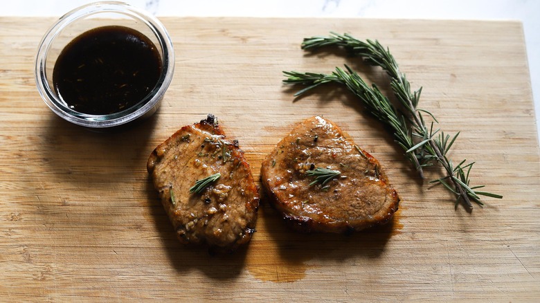 pork chops on cutting board