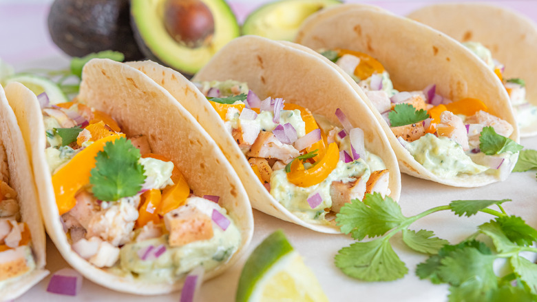 three smoked chicken tacos