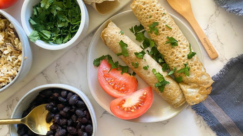 injera, beans, tomato and parsley