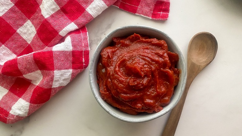 bowl with ketchup and spoon