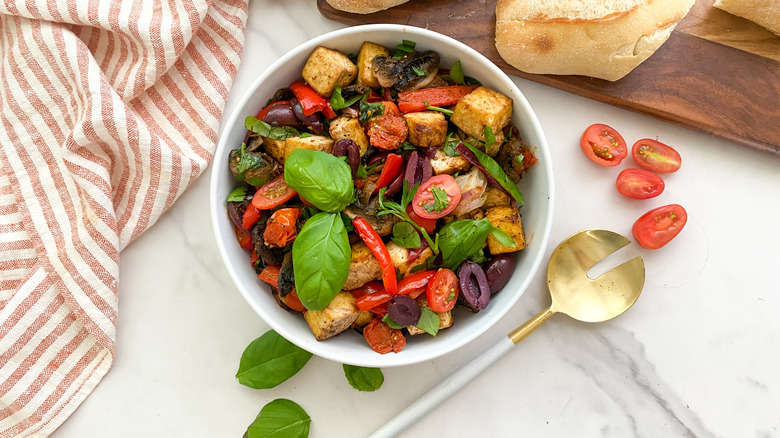 Mediterranean sheet pan tofu in white bowl