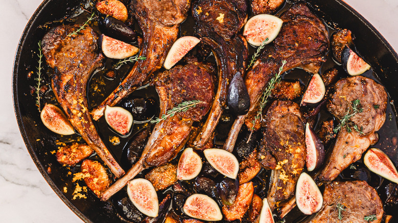 A pan of roasted lamb chops with thyme and figs