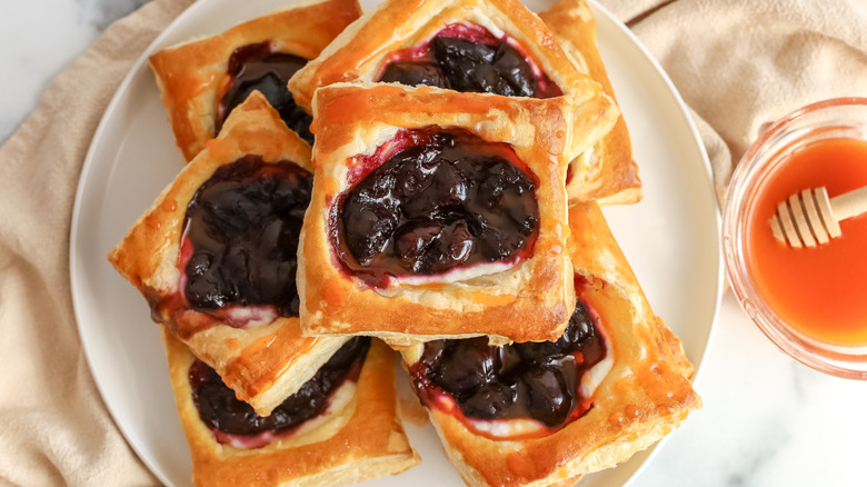Stack of sweet and spicy cherry tarts on a plate
