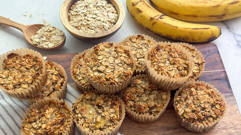 Banana oatmeal muffins on wooden board
