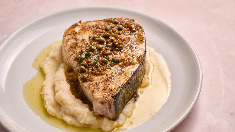 seared swordfish steak on a plate