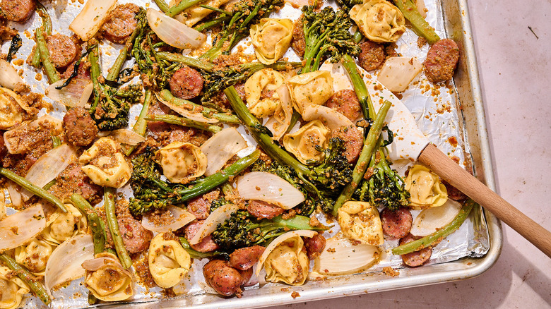 roasted vegetables and sausage on a sheet pan