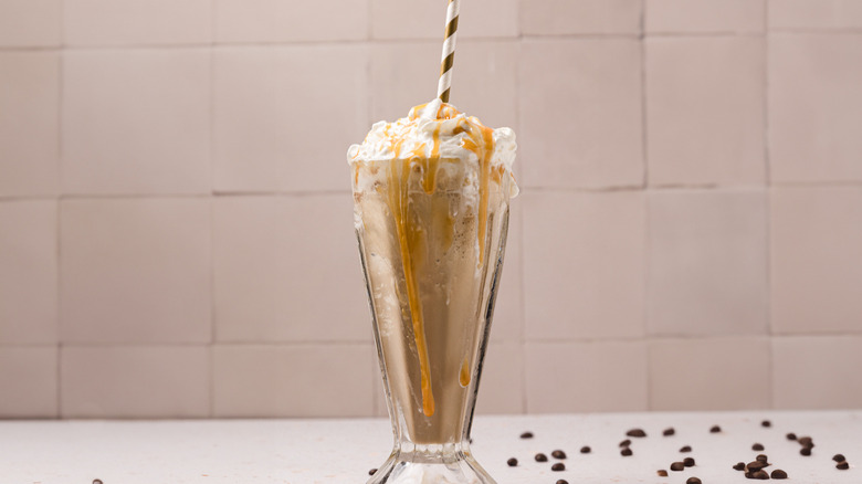 McDonalds caramel frappe against tile background