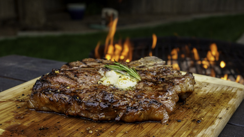 Charred T-bone steak with rosemary butter