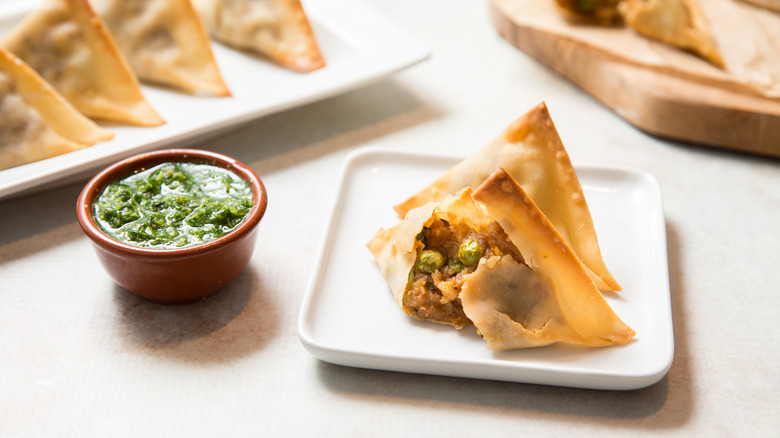 baked samosas served on table