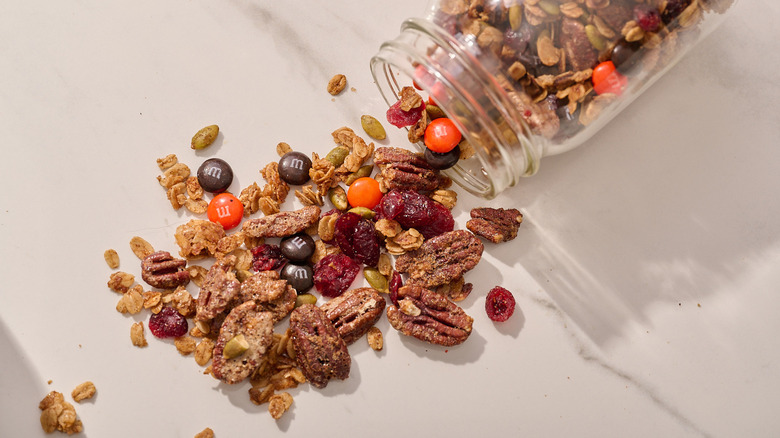 trail mix spilling out of glass jar