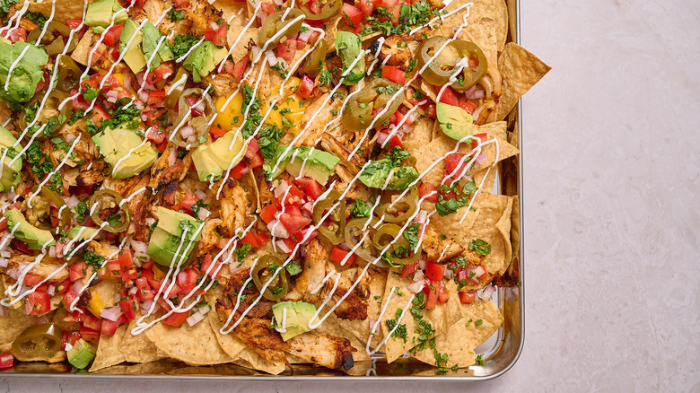 sheet pan full of chicken nachos