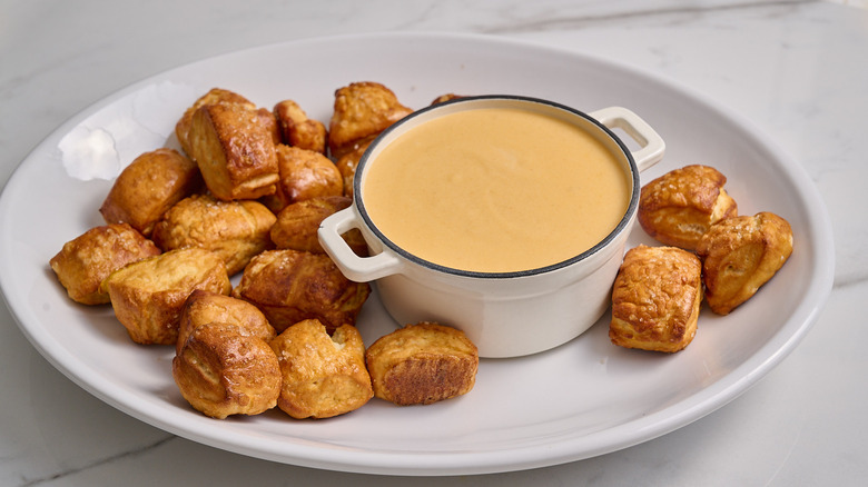 pretzel bites on a platter with beer cheese