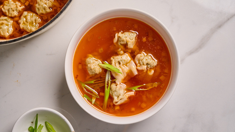 wonton soup in a bowl on a table