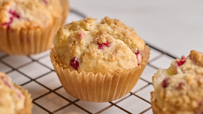 raspberry muffin on a wire rack