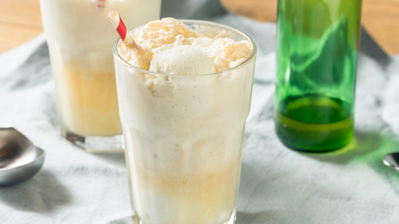 Boston cooler with milkshake straw and green glass bottle in background
