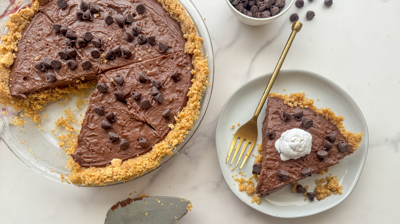 Chocolate pudding pie with slice removed to plate