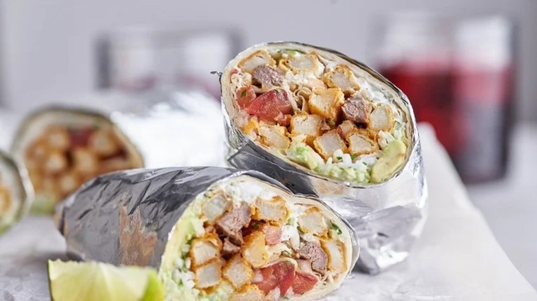 California-style carne asada burrito in foil wrapper
