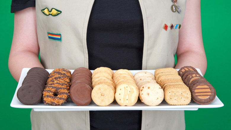 Girl Scout holding tray of cookies