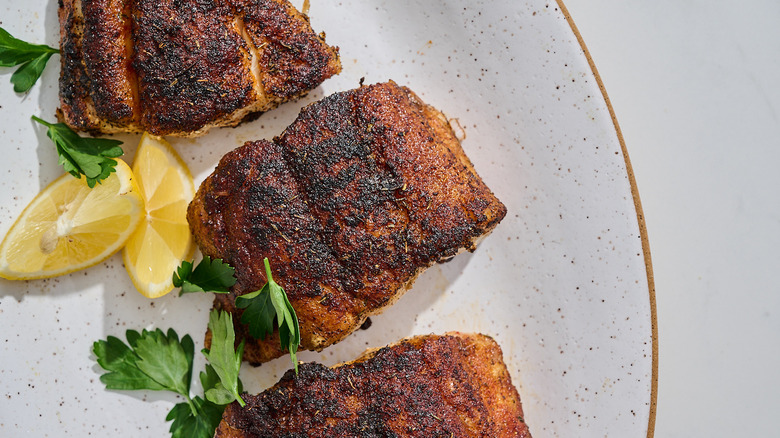 blackened grouper filet on a platter