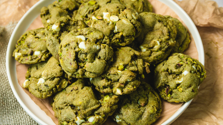 White chocolate matcha cookies on white plate