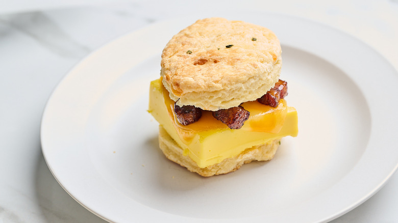 bacon and egg sandwich on a plate
