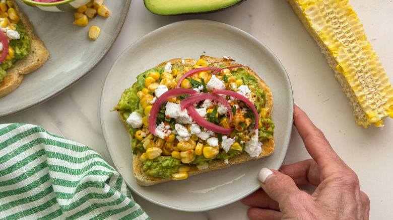 elote avocado toast on plate