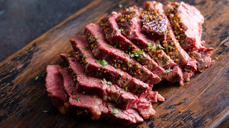 Slices of corned beef on a chopping board