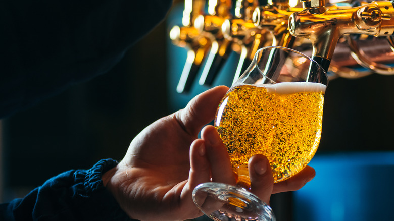 Bartender pouring draft beer