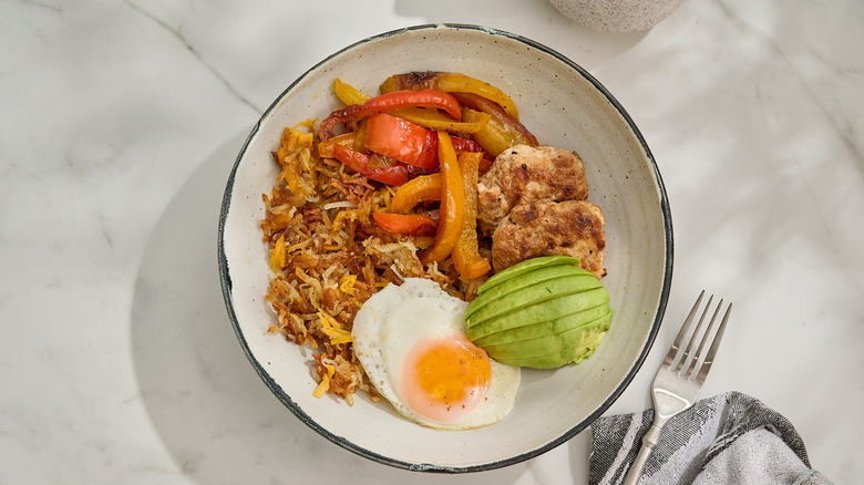 Chicken sausage and hash brown bowl on a table