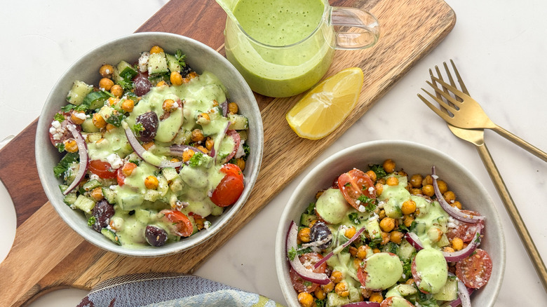 Chickpea salad with tzatziki dressing in bowls