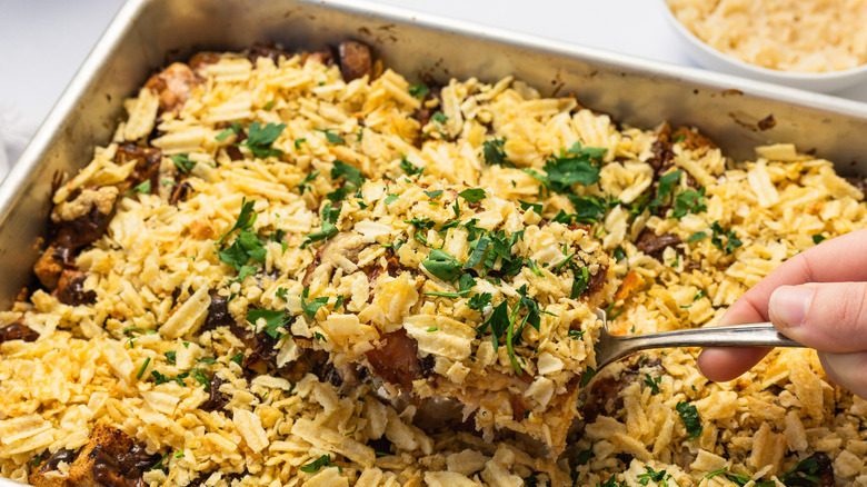 Lifting a serving from the corned beef Reuben casserole.