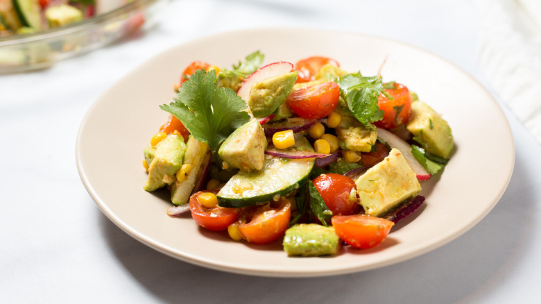 colorful avocado salad on plate