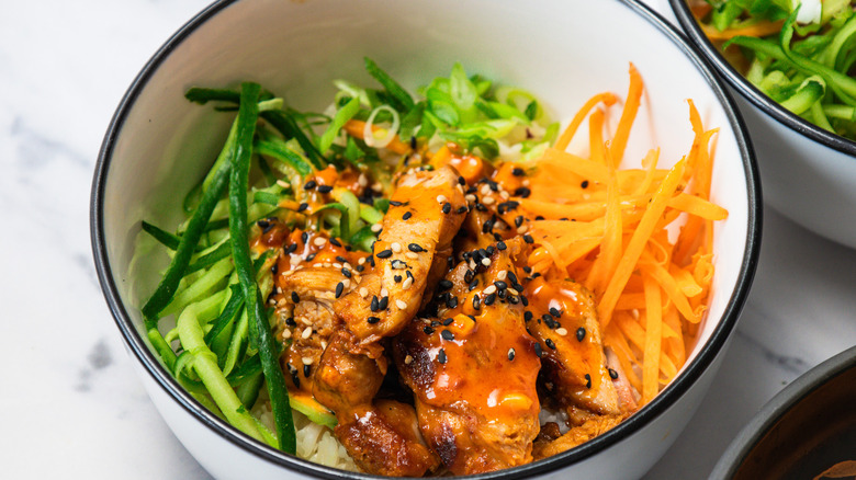 Close up on Korean BBQ chicken rice bowl.