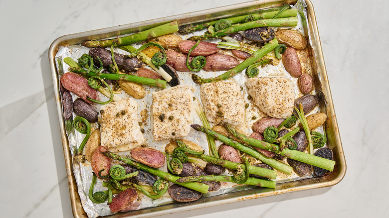 halibut and vegetables on a sheet pan