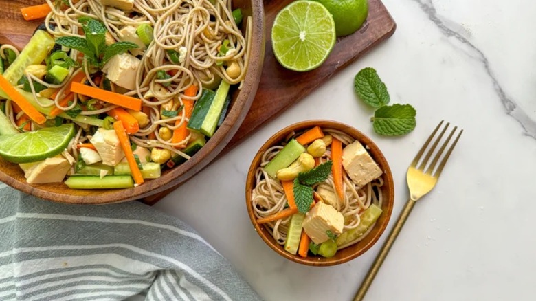 Silken Tofu And Soba Noodle Salad in two wooden bowls with fork