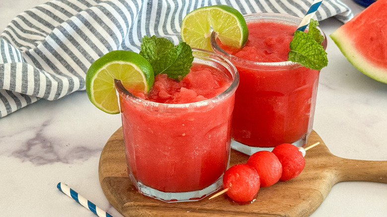 Watermelon slushies garnished with mint and lime wheels