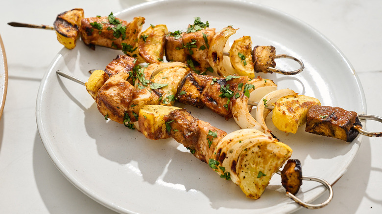 swordfish kebabs on a plate