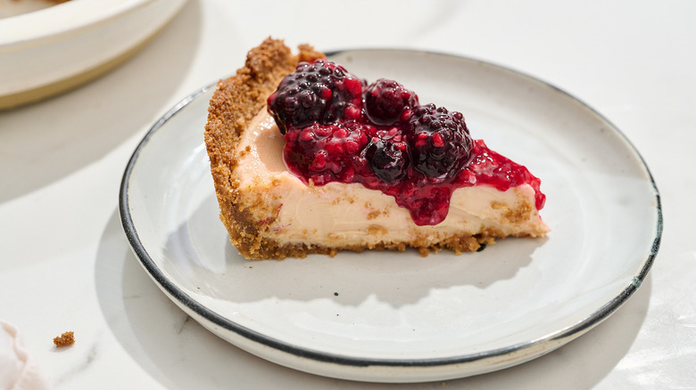 Slice of berry key lime pie on a plate