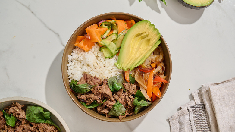 thai basil beef bowl on a table
