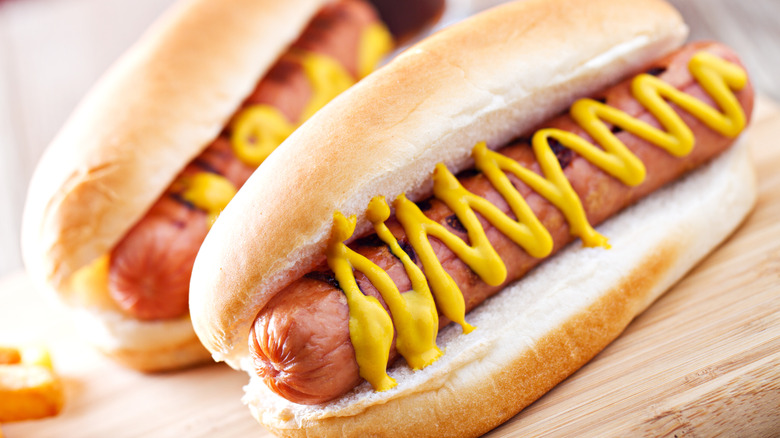 Hot dogs in buns with mustard