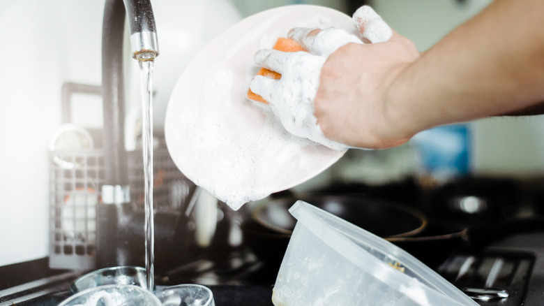 stainless steel sink with a gold faucet