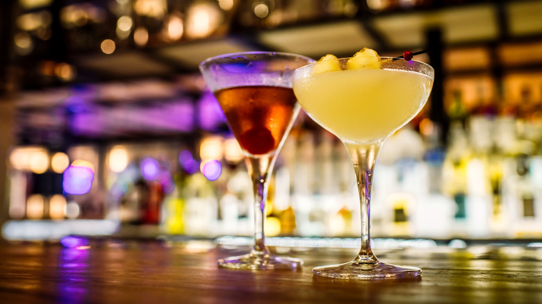 two cocktails on a bar