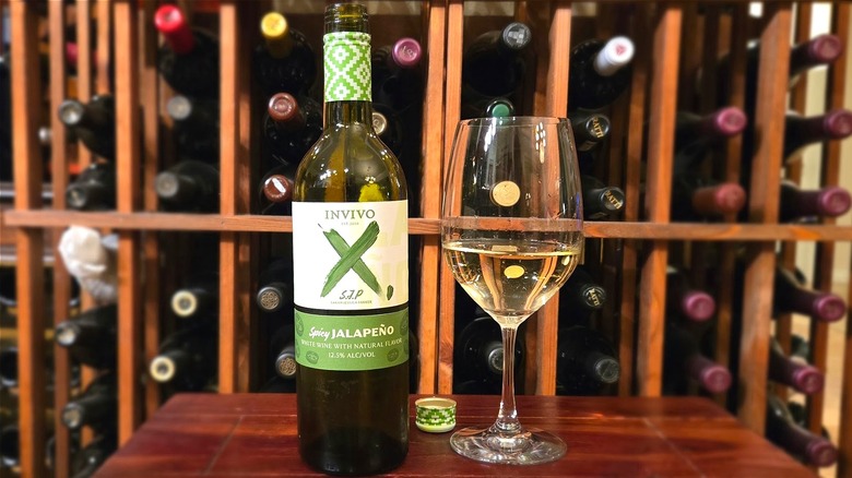 Bottle of Invivo X, Sarah Jessica Parker Spicy Jalapeño White Wine with glass