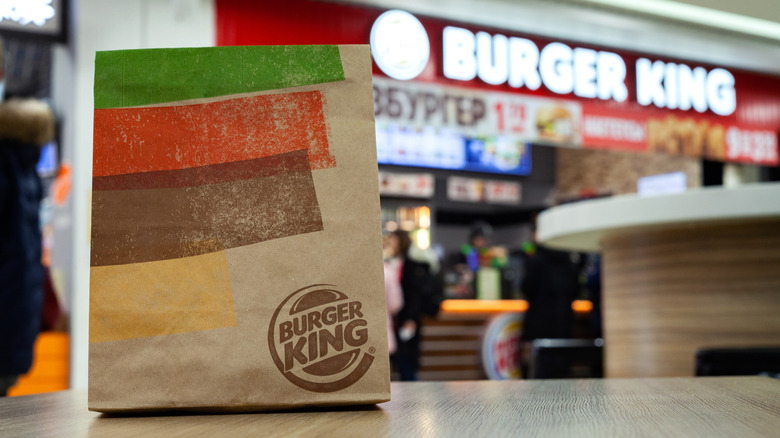 Burger King takeout bag in front of storefront