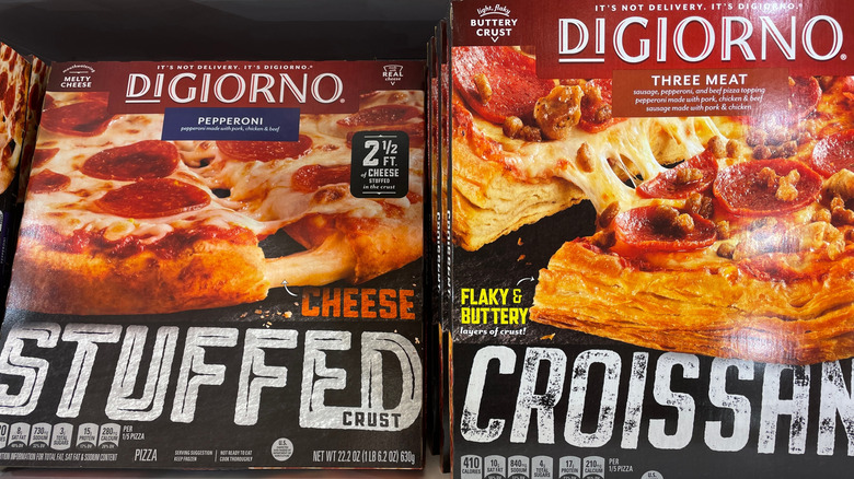 DiGiorno pizzas in the freezer of the grocery store