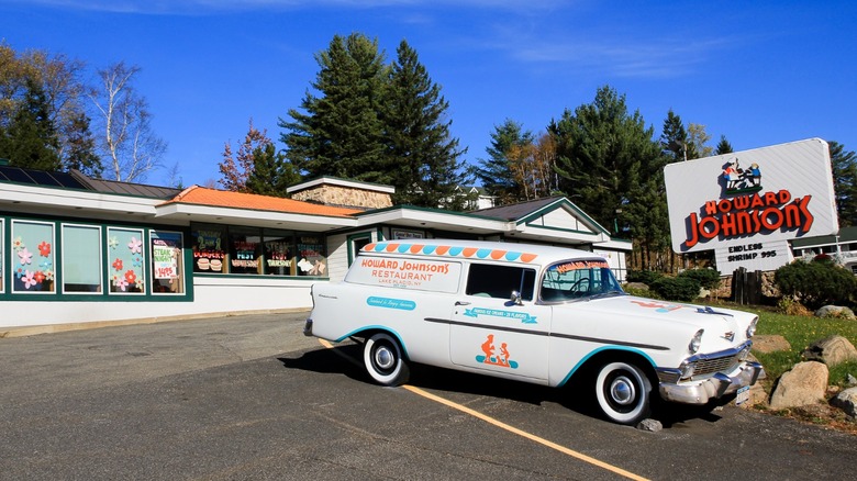 Howard Johnson's location with a vintage delivery car parked in front