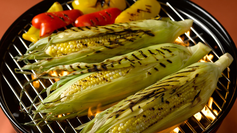 Grilled corn and peppers on a Weber charcoal grill